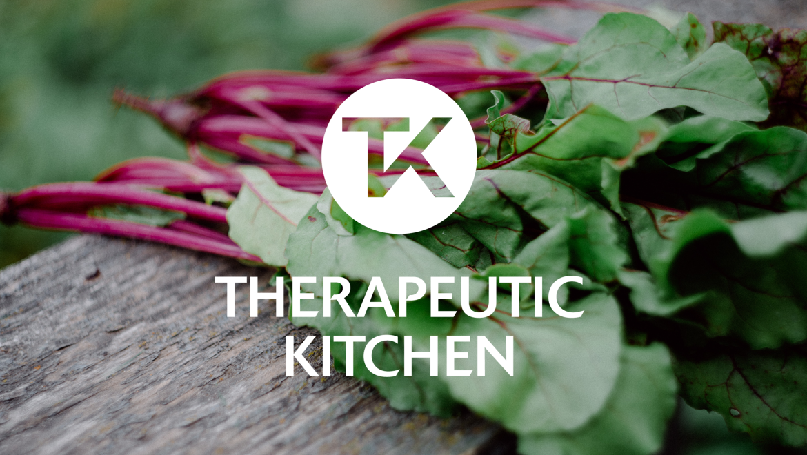 Therapeutic Kitchen logo design on a photograph of healthy food